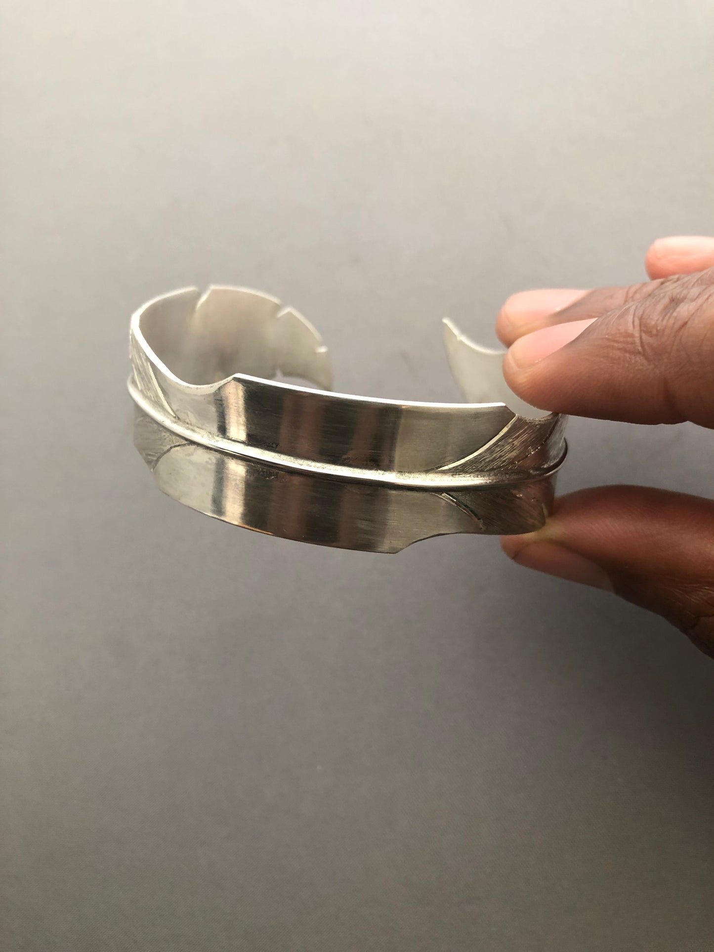 Ladies solid silver feather bangle